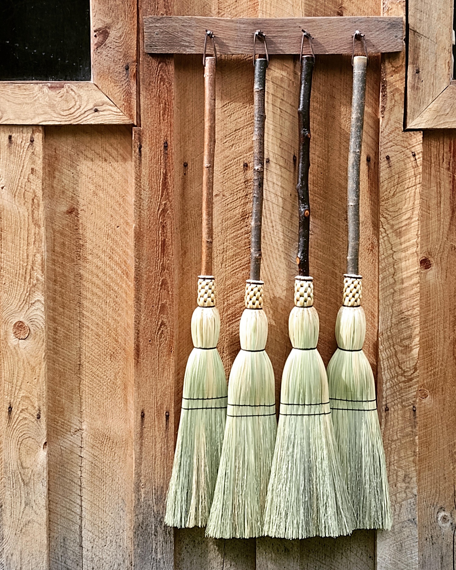 Rustic camper brooms drying in the sun